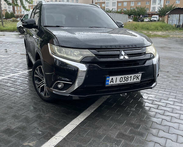 Черный Мицубиси Аутлендер, объемом двигателя 3 л и пробегом 257 тыс. км за 13699 $, фото 1 на Automoto.ua