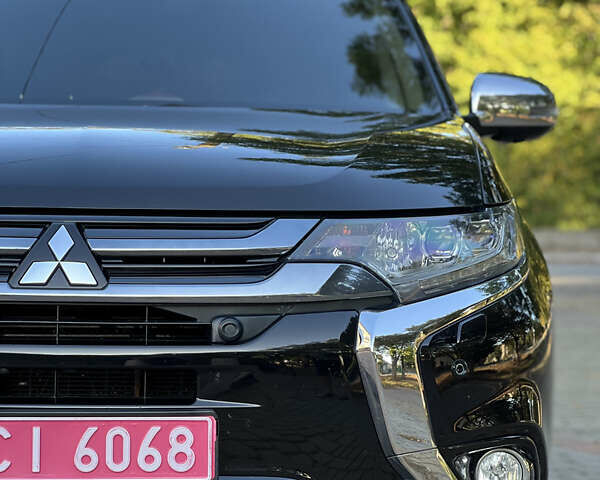 Чорний Міцубісі Аутлендер, об'ємом двигуна 2 л та пробігом 233 тис. км за 18000 $, фото 1 на Automoto.ua