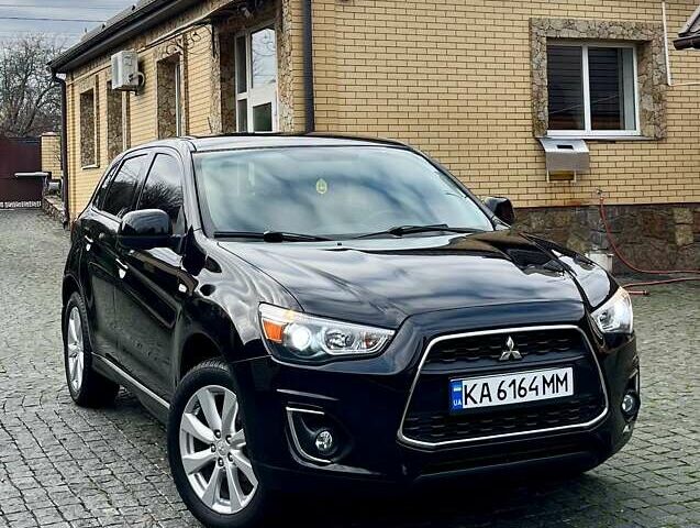 Чорний Міцубісі Аутлендер, об'ємом двигуна 2 л та пробігом 170 тис. км за 10999 $, фото 1 на Automoto.ua
