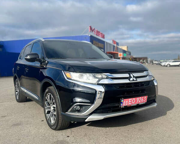Черный Мицубиси Аутлендер, объемом двигателя 2.36 л и пробегом 91 тыс. км за 15500 $, фото 1 на Automoto.ua