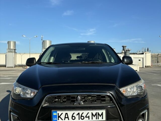 Черный Мицубиси Аутлендер, объемом двигателя 2 л и пробегом 105 тыс. км за 9999 $, фото 1 на Automoto.ua