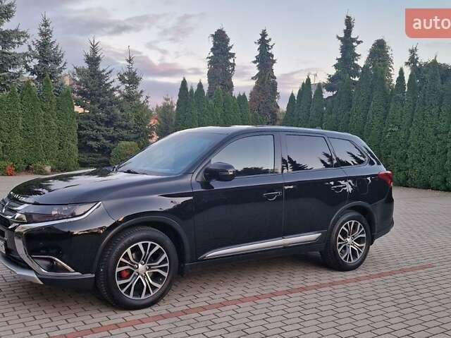 Черный Мицубиси Аутлендер, объемом двигателя 2.36 л и пробегом 168 тыс. км за 14999 $, фото 1 на Automoto.ua