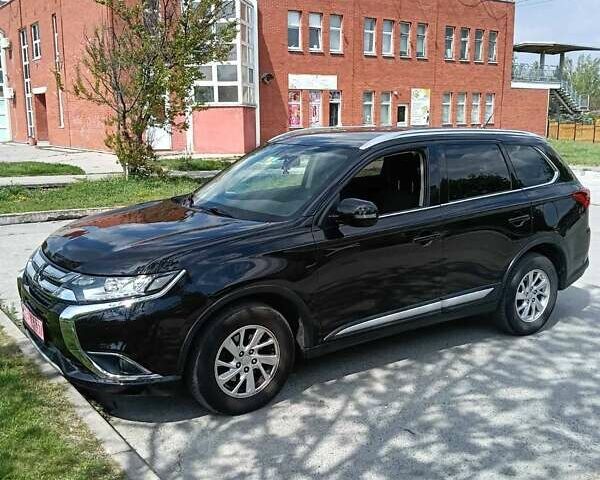 Черный Мицубиси Аутлендер, объемом двигателя 2.2 л и пробегом 141 тыс. км за 16700 $, фото 1 на Automoto.ua
