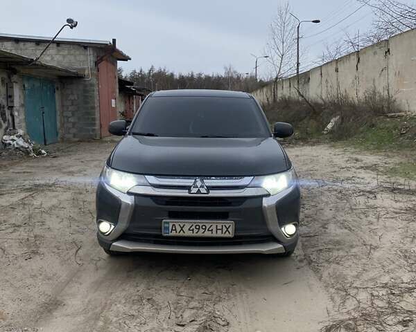 Черный Мицубиси Аутлендер, объемом двигателя 2.4 л и пробегом 185 тыс. км за 14300 $, фото 1 на Automoto.ua