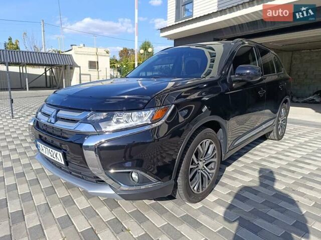 Черный Мицубиси Аутлендер, объемом двигателя 2.36 л и пробегом 120 тыс. км за 16900 $, фото 1 на Automoto.ua