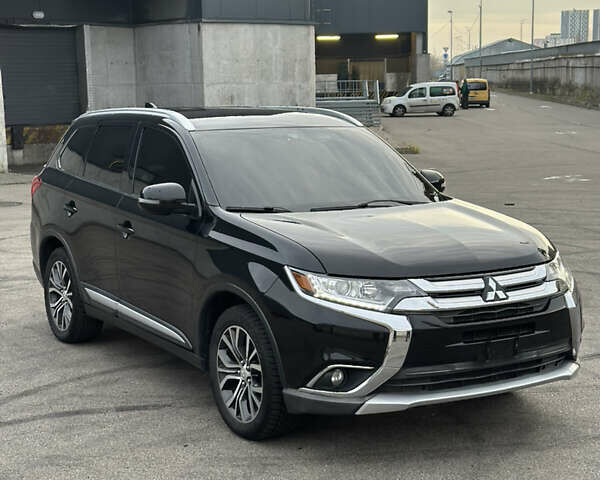 Черный Мицубиси Аутлендер, объемом двигателя 2.36 л и пробегом 128 тыс. км за 15500 $, фото 1 на Automoto.ua