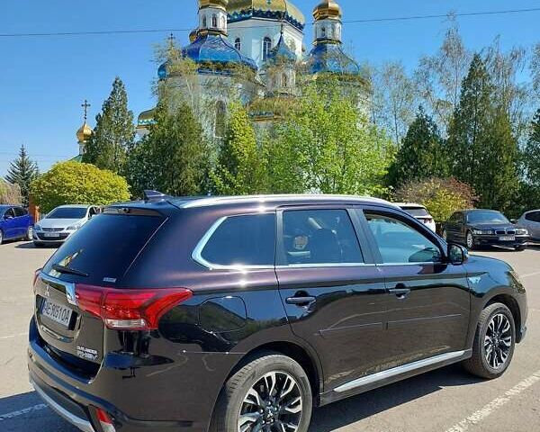 Черный Мицубиси Аутлендер, объемом двигателя 2 л и пробегом 106 тыс. км за 22300 $, фото 1 на Automoto.ua