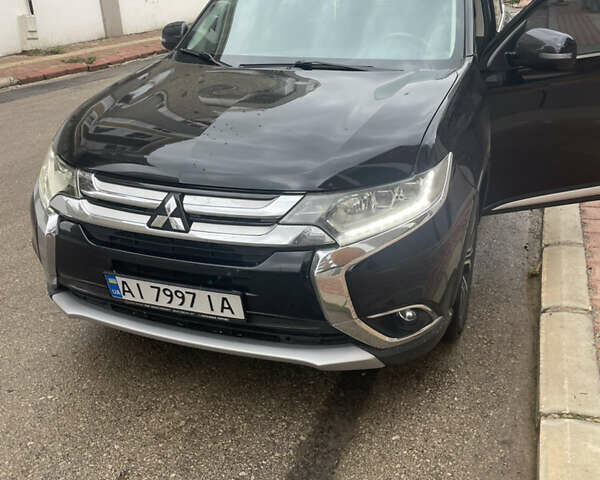 Чорний Міцубісі Аутлендер, об'ємом двигуна 2.4 л та пробігом 180 тис. км за 15500 $, фото 1 на Automoto.ua