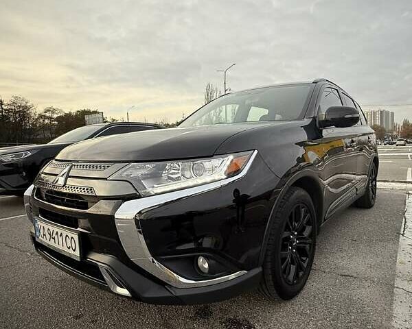 Черный Мицубиси Аутлендер, объемом двигателя 2.36 л и пробегом 153 тыс. км за 14800 $, фото 1 на Automoto.ua