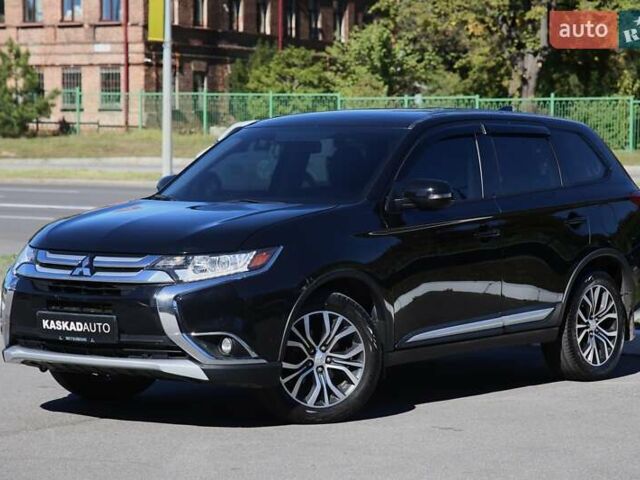 Черный Мицубиси Аутлендер, объемом двигателя 2.4 л и пробегом 130 тыс. км за 16200 $, фото 1 на Automoto.ua