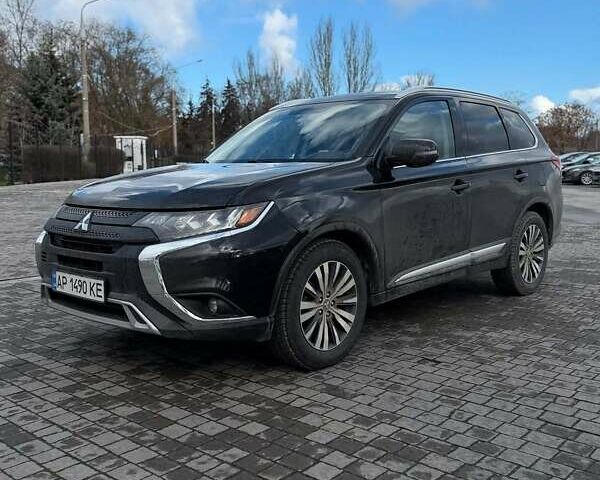 Черный Мицубиси Аутлендер, объемом двигателя 2.36 л и пробегом 91 тыс. км за 18300 $, фото 1 на Automoto.ua