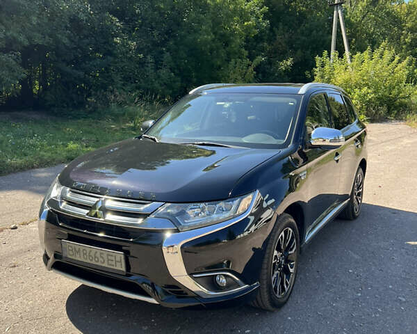 Черный Мицубиси Аутлендер, объемом двигателя 2 л и пробегом 54 тыс. км за 21500 $, фото 1 на Automoto.ua