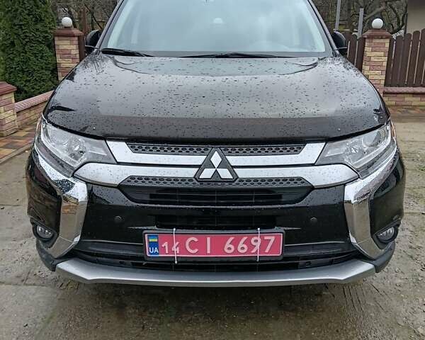 Чорний Міцубісі Аутлендер, об'ємом двигуна 2 л та пробігом 96 тис. км за 22000 $, фото 1 на Automoto.ua