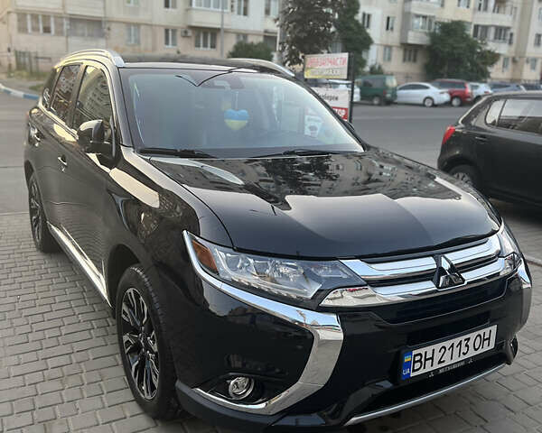 Чорний Міцубісі Аутлендер, об'ємом двигуна 2 л та пробігом 155 тис. км за 22500 $, фото 1 на Automoto.ua