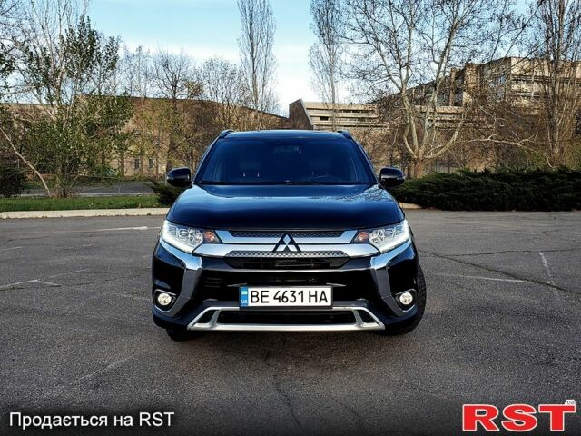 Черный Мицубиси Аутлендер, объемом двигателя 2.4 л и пробегом 130 тыс. км за 16499 $, фото 1 на Automoto.ua