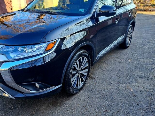 Чорний Міцубісі Аутлендер, об'ємом двигуна 2.4 л та пробігом 102 тис. км за 19200 $, фото 1 на Automoto.ua