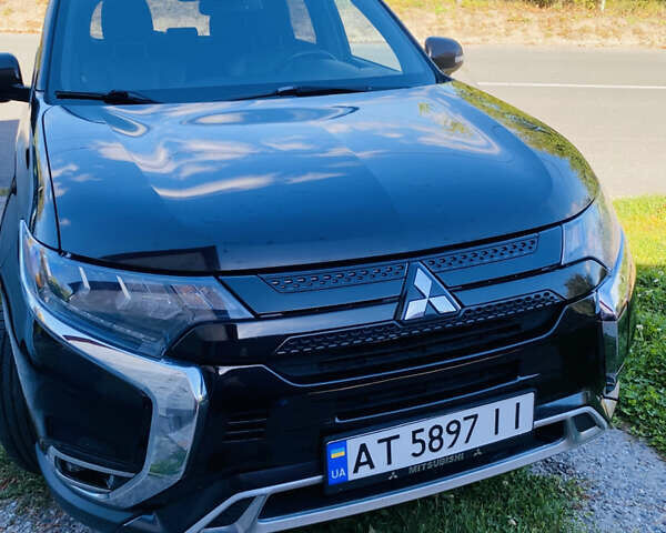 Чорний Міцубісі Аутлендер, об'ємом двигуна 2 л та пробігом 143 тис. км за 24000 $, фото 1 на Automoto.ua