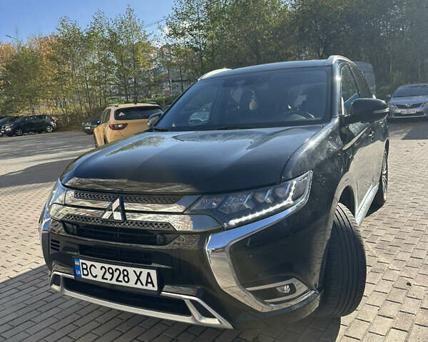 Чорний Міцубісі Аутлендер, об'ємом двигуна 2.36 л та пробігом 174 тис. км за 27800 $, фото 1 на Automoto.ua