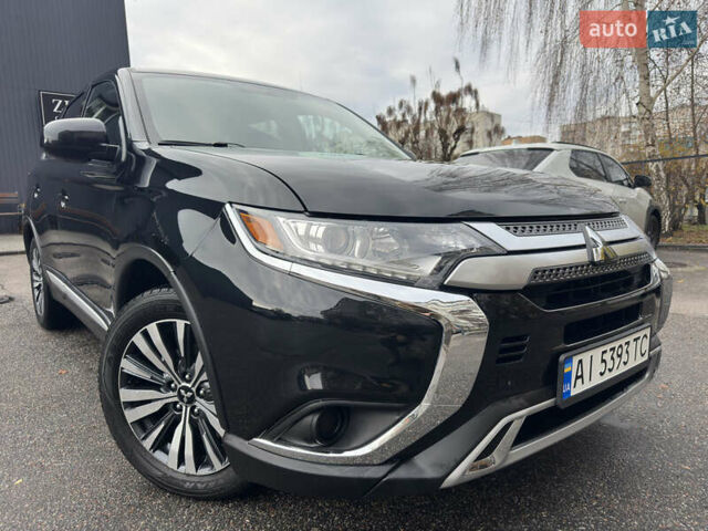 Черный Мицубиси Аутлендер, объемом двигателя 2.4 л и пробегом 44 тыс. км за 18700 $, фото 1 на Automoto.ua