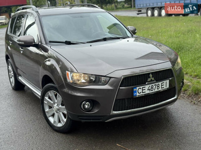 Коричневий Міцубісі Аутлендер, об'ємом двигуна 2.36 л та пробігом 200 тис. км за 9150 $, фото 1 на Automoto.ua