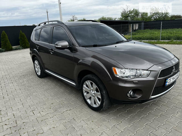 Коричневый Мицубиси Аутлендер, объемом двигателя 2.27 л и пробегом 290 тыс. км за 11950 $, фото 1 на Automoto.ua