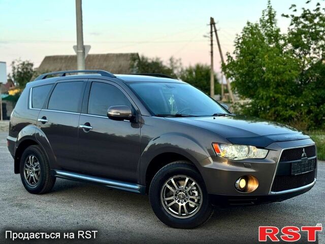 Коричневый Мицубиси Аутлендер, объемом двигателя 2.4 л и пробегом 178 тыс. км за 10550 $, фото 1 на Automoto.ua