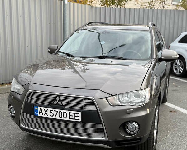 Коричневый Мицубиси Аутлендер, объемом двигателя 2.36 л и пробегом 191 тыс. км за 10900 $, фото 1 на Automoto.ua