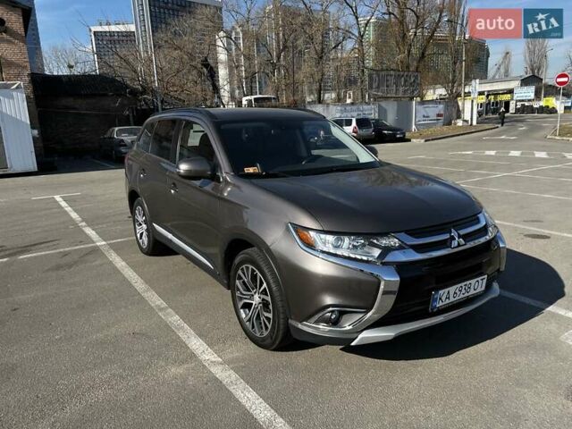 Коричневый Мицубиси Аутлендер, объемом двигателя 2.36 л и пробегом 89 тыс. км за 14800 $, фото 1 на Automoto.ua