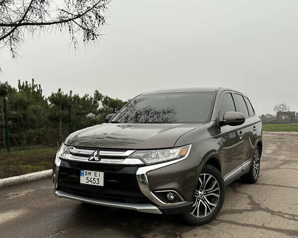 Коричневий Міцубісі Аутлендер, об'ємом двигуна 2.36 л та пробігом 197 тис. км за 14000 $, фото 1 на Automoto.ua