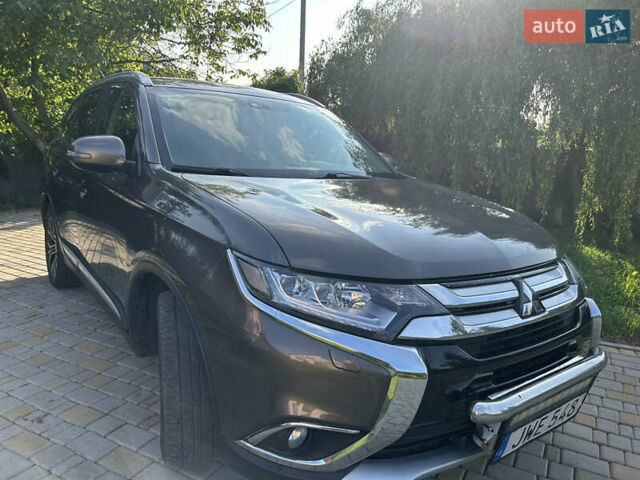 Коричневий Міцубісі Аутлендер, об'ємом двигуна 2.3 л та пробігом 256 тис. км за 16399 $, фото 1 на Automoto.ua