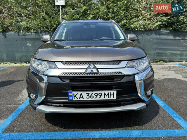 Коричневый Мицубиси Аутлендер, объемом двигателя 2.36 л и пробегом 190 тыс. км за 15500 $, фото 1 на Automoto.ua