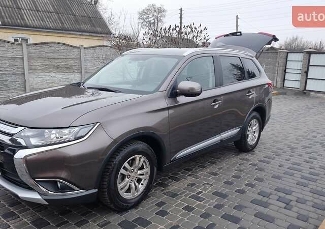 Коричневий Міцубісі Аутлендер, об'ємом двигуна 2 л та пробігом 100 тис. км за 20000 $, фото 1 на Automoto.ua