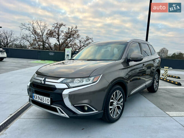 Коричневый Мицубиси Аутлендер, объемом двигателя 2.4 л и пробегом 192 тыс. км за 19500 $, фото 1 на Automoto.ua