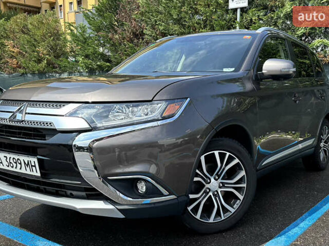 Коричневый Мицубиси Аутлендер, объемом двигателя 2.36 л и пробегом 185 тыс. км за 17670 $, фото 1 на Automoto.ua