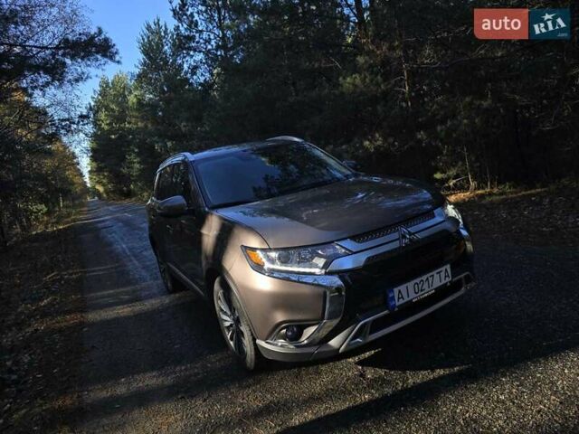 Коричневый Мицубиси Аутлендер, объемом двигателя 2.36 л и пробегом 69 тыс. км за 19700 $, фото 1 на Automoto.ua