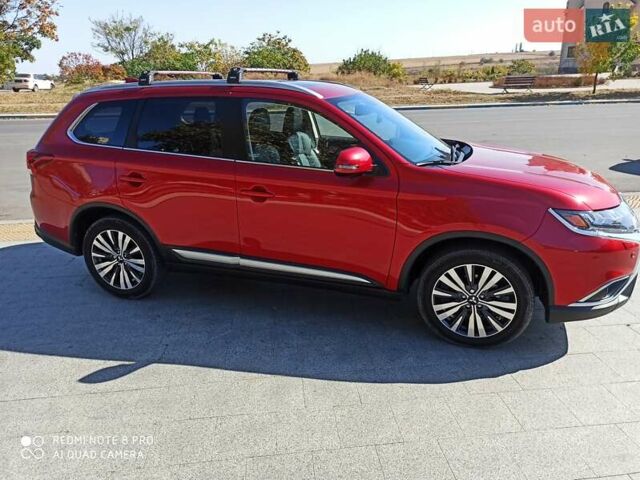 Червоний Міцубісі Аутлендер, об'ємом двигуна 2.4 л та пробігом 70 тис. км за 18500 $, фото 1 на Automoto.ua