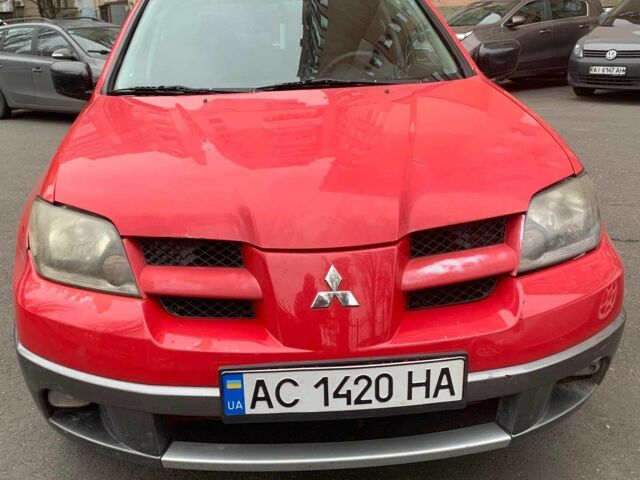 Красный Мицубиси Аутлендер, объемом двигателя 2 л и пробегом 344 тыс. км за 4300 $, фото 1 на Automoto.ua
