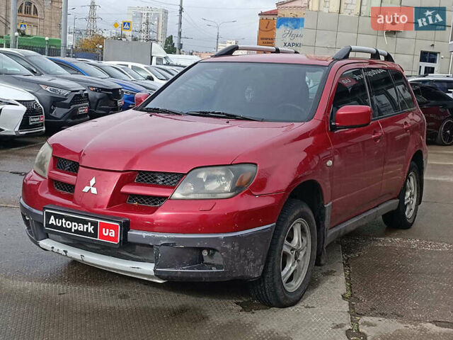 Красный Мицубиси Аутлендер, объемом двигателя 2.4 л и пробегом 226 тыс. км за 5490 $, фото 1 на Automoto.ua
