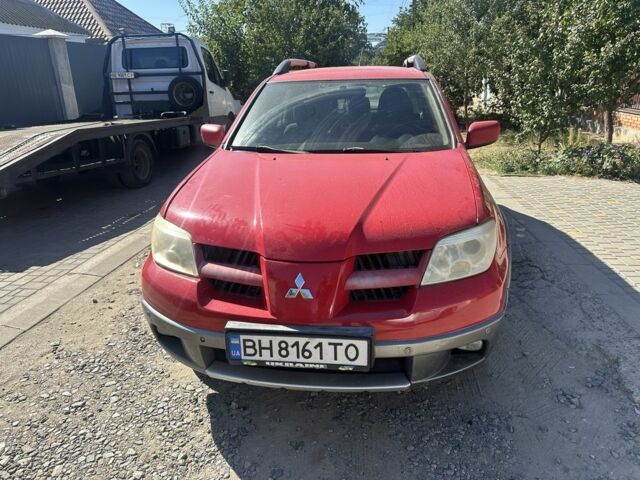 Червоний Міцубісі Аутлендер, об'ємом двигуна 2.4 л та пробігом 235 тис. км за 3999 $, фото 1 на Automoto.ua