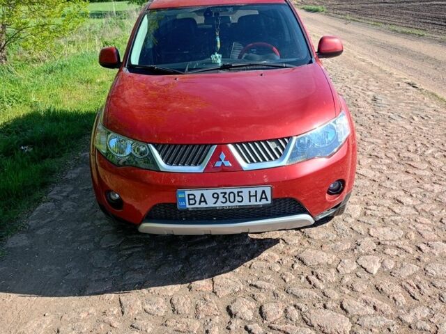Красный Мицубиси Аутлендер, объемом двигателя 2.4 л и пробегом 207 тыс. км за 8500 $, фото 1 на Automoto.ua