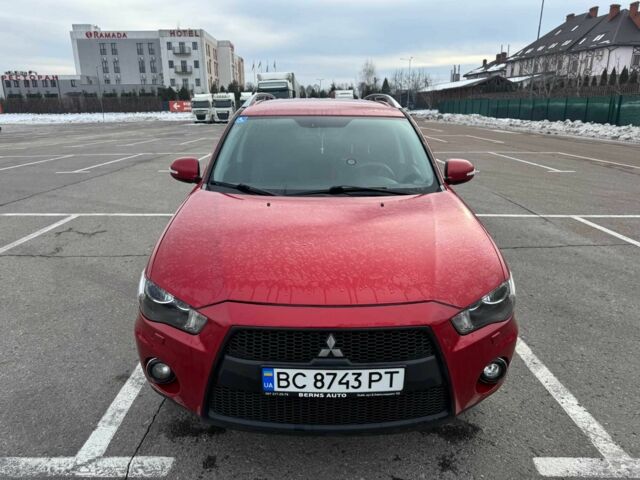 Красный Мицубиси Аутлендер, объемом двигателя 2.4 л и пробегом 201 тыс. км за 9750 $, фото 1 на Automoto.ua