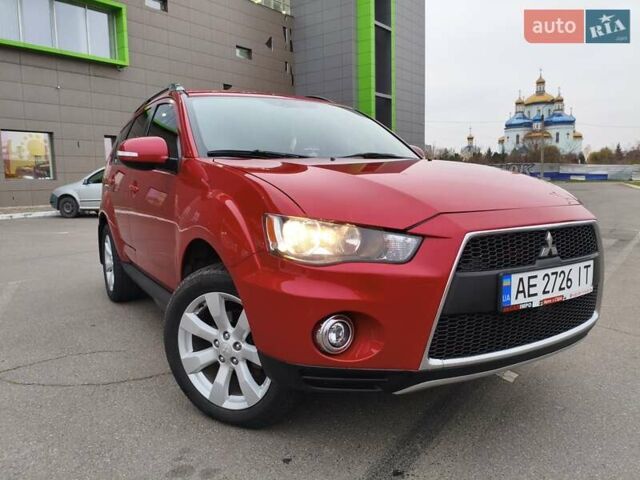 Красный Мицубиси Аутлендер, объемом двигателя 2.36 л и пробегом 93 тыс. км за 11499 $, фото 1 на Automoto.ua