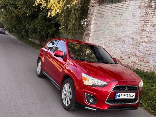 Красный Мицубиси Аутлендер, объемом двигателя 2 л и пробегом 200 тыс. км за 9100 $, фото 1 на Automoto.ua