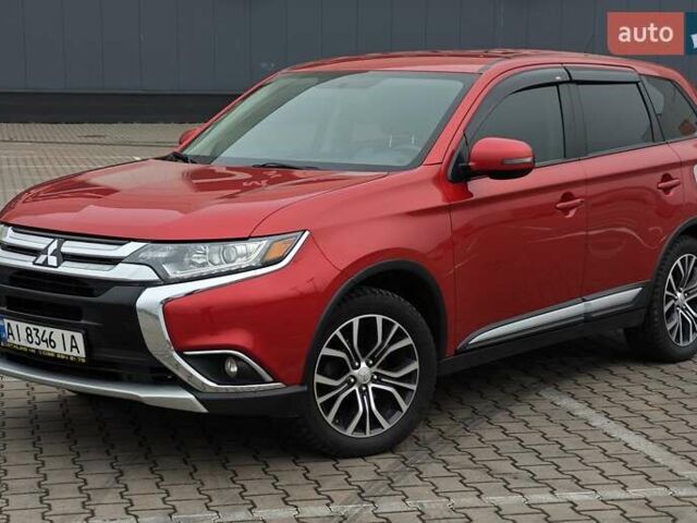 Красный Мицубиси Аутлендер, объемом двигателя 2.36 л и пробегом 123 тыс. км за 15300 $, фото 1 на Automoto.ua