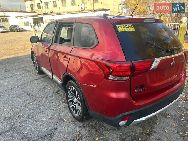 Красный Мицубиси Аутлендер, объемом двигателя 2.36 л и пробегом 180 тыс. км за 5000 $, фото 1 на Automoto.ua