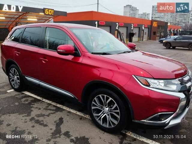 Красный Мицубиси Аутлендер, объемом двигателя 2.36 л и пробегом 118 тыс. км за 14000 $, фото 1 на Automoto.ua