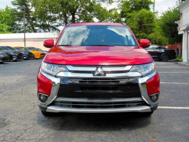 Красный Мицубиси Аутлендер, объемом двигателя 2.4 л и пробегом 70 тыс. км за 2400 $, фото 1 на Automoto.ua