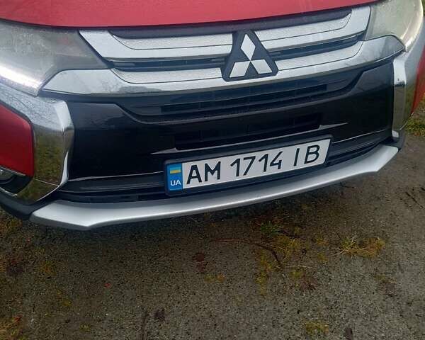 Красный Мицубиси Аутлендер, объемом двигателя 2.36 л и пробегом 131 тыс. км за 16300 $, фото 1 на Automoto.ua