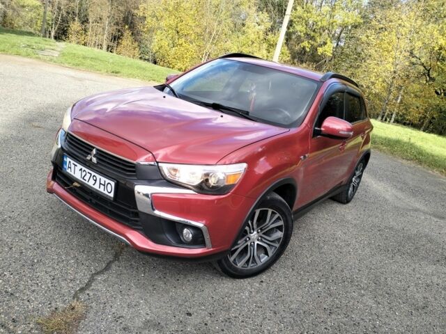 Красный Мицубиси Аутлендер, объемом двигателя 2.4 л и пробегом 185 тыс. км за 12200 $, фото 1 на Automoto.ua