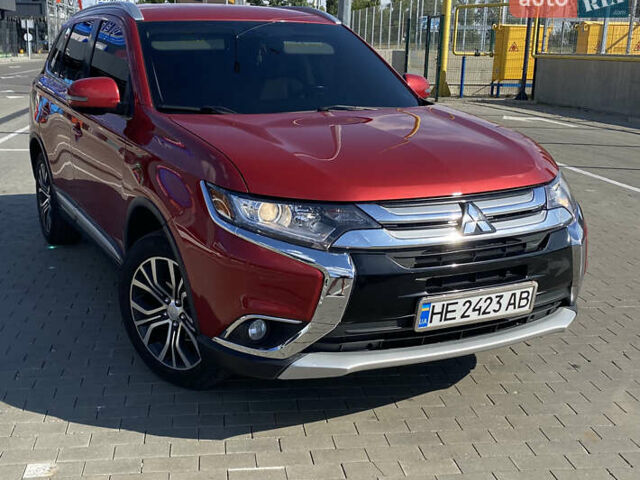 Красный Мицубиси Аутлендер, объемом двигателя 2.4 л и пробегом 113 тыс. км за 15900 $, фото 1 на Automoto.ua